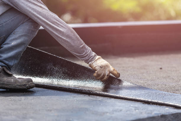 Professional Waterproofing technician working in Bailey, MI